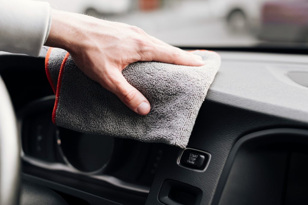 Free Photo  Close up of person cleaning car exterior